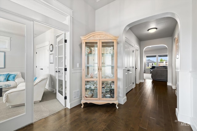 foyer entrance featuring dark hardwood / wood-style floors