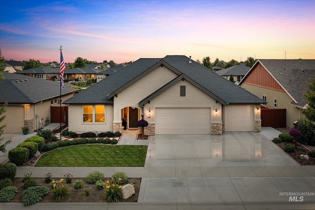 view of front of house featuring a yard and a garage