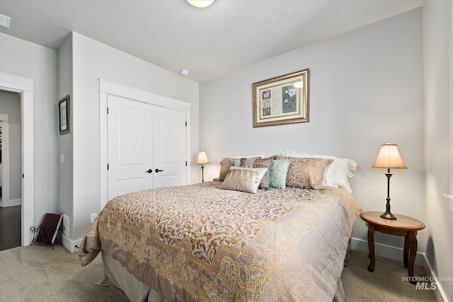 carpeted bedroom with a closet