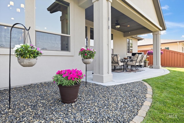 view of patio / terrace featuring ceiling fan