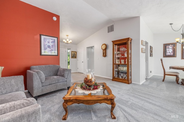 living room featuring a chandelier, vaulted ceiling, carpet floors, and baseboards
