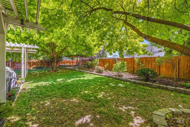 view of yard with a pergola