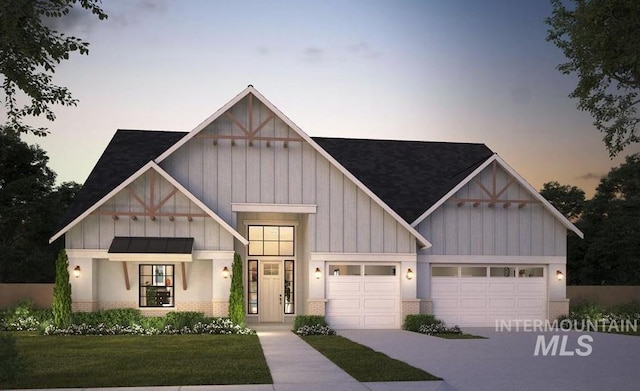 modern farmhouse style home featuring brick siding, board and batten siding, a front lawn, a garage, and driveway