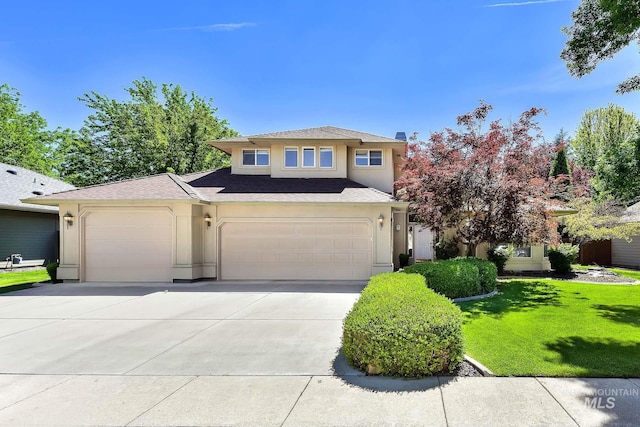 view of front of property featuring concrete driveway, stucco siding, a front lawn, a garage, and roof with shingles