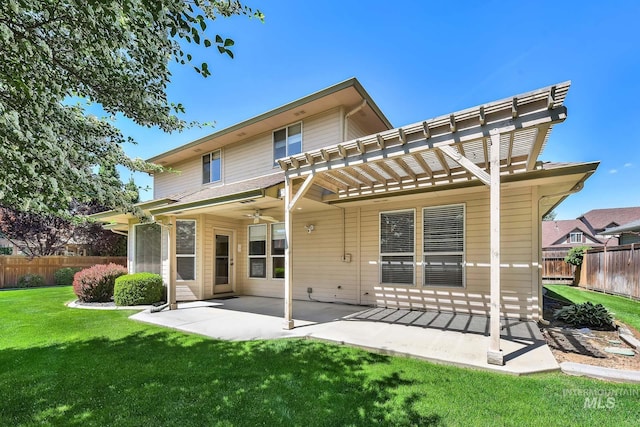 back of property with a pergola, ceiling fan, and a patio area