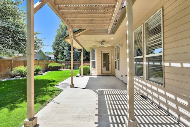 view of patio featuring ceiling fan