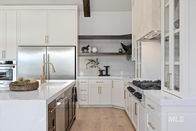1948 Red Rock Way, Twin Falls, ID 83301 - kitchen featuring appliances with stainless steel finishes, open shelves, backsplash, white cabinetry, and light stone countertops