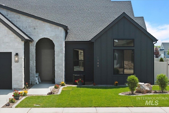 1948 Red Rock Way, Twin Falls, ID 83301 - view of front of property featuring board and batten siding, stone siding, and a shingled roof