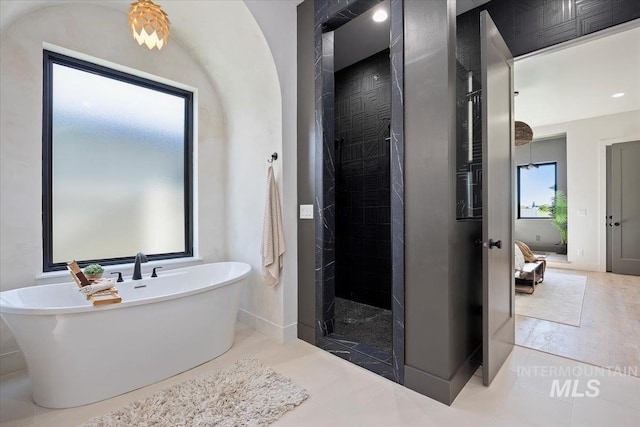 1948 Red Rock Way, Twin Falls, ID 83301 - ensuite bathroom featuring a walk in shower and a soaking tub