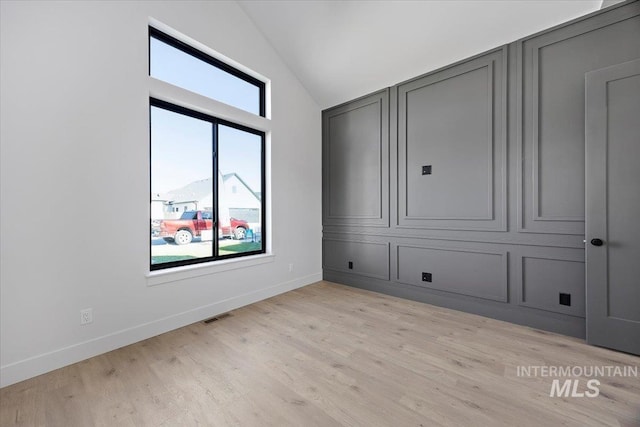 1948 Red Rock Way, Twin Falls, ID 83301 - unfurnished bedroom with vaulted ceiling and light wood-style floors