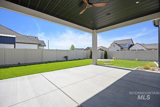 1948 Red Rock Way, Twin Falls, ID 83301 - fenced backyard featuring ceiling fan, a patio area, and a residential view