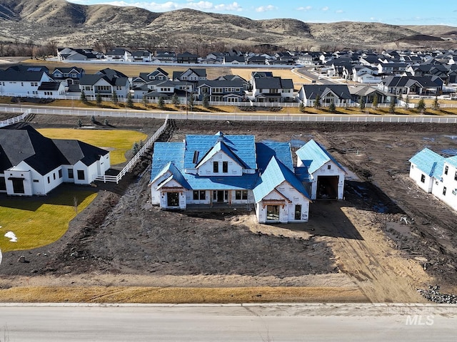 bird's eye view featuring a residential view and a mountain view