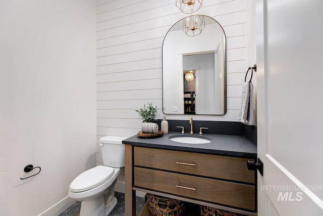 bathroom featuring toilet and vanity