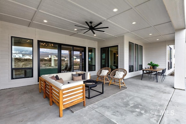 view of patio / terrace with a ceiling fan, outdoor dining area, and an outdoor living space