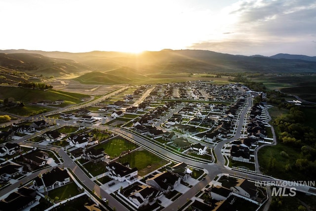 birds eye view of property with a residential view and a mountain view