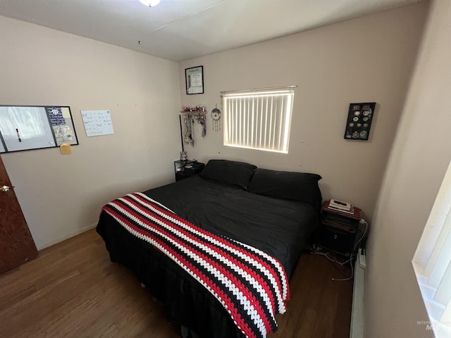 bedroom featuring wood finished floors