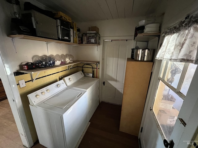 clothes washing area with wood ceiling and washing machine and dryer