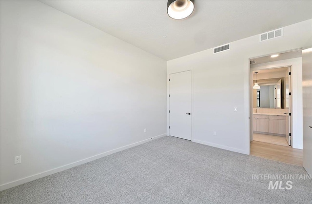 4340 E Haystack St Unit 101, Boise, ID 83716 - unfurnished bedroom with light colored carpet and baseboards