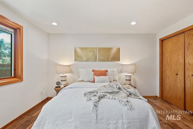 9421 W Rifleman St, Boise, ID 83703 - bedroom featuring wood finished floors, baseboards, recessed lighting, and a closet