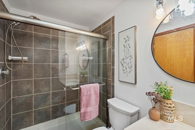 9421 W Rifleman St, Boise, ID 83703 - bathroom with toilet, a tile shower, and vanity