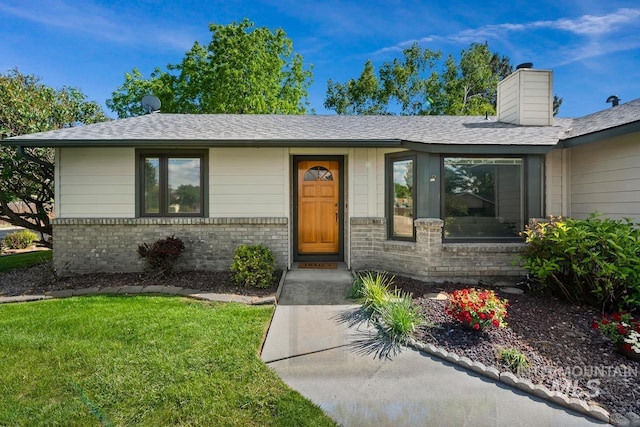 9421 W Rifleman St, Boise, ID 83703 - single story home with brick siding, a front lawn, a chimney, and roof with shingles