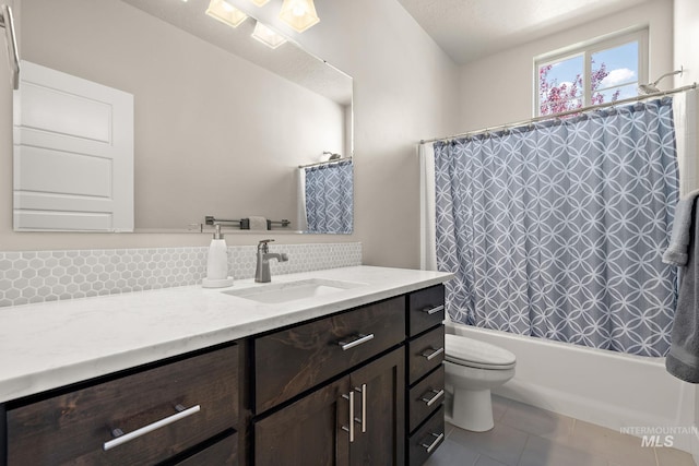 11153 W Brett Dr, Nampa, ID 83686 - full bathroom featuring vanity, toilet, shower / bath combo, and tile patterned flooring