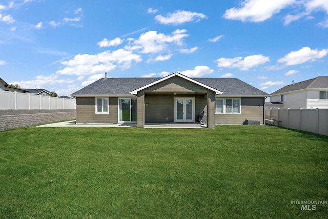 11153 W Brett Dr, Nampa, ID 83686 - rear view of house featuring french doors, a patio area, and a shingled roof