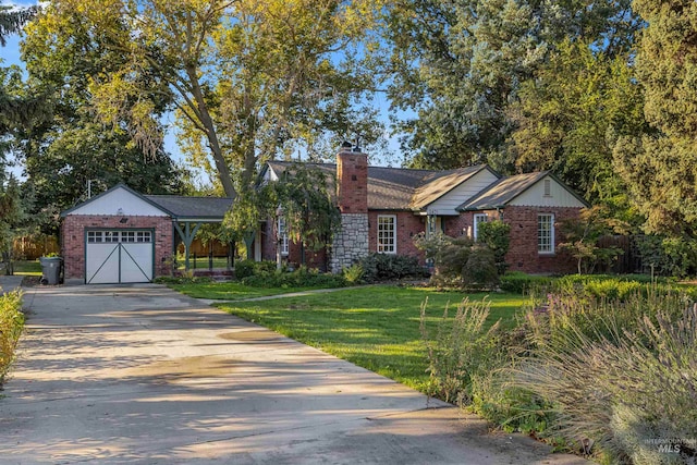 ranch-style home with concrete driveway, a front yard, an attached garage, brick siding, and a chimney