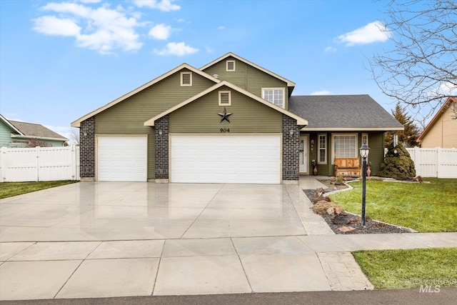 view of front of property featuring a garage and a front yard