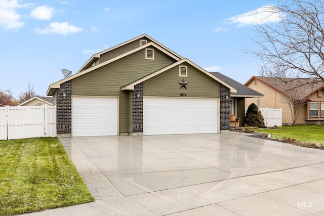 view of front of home featuring a garage and a front lawn