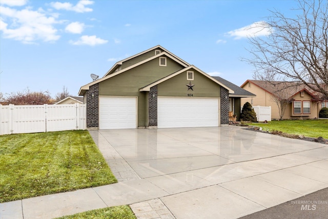 single story home with a garage and a front lawn