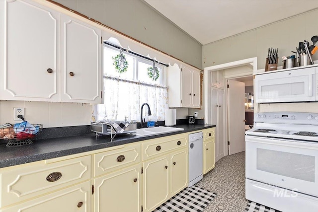 201 9th Ave N, Buhl, ID 83316 - kitchen featuring white appliances, a sink, dark countertops, and cream cabinetry