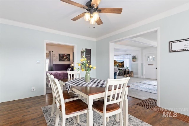 201 9th Ave N, Buhl, ID 83316 - dining area featuring wood finished floors, a ceiling fan, and crown molding
