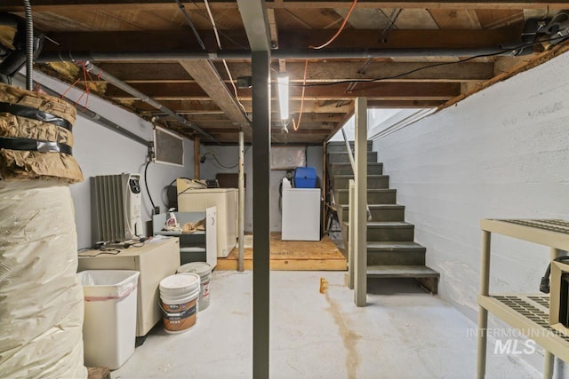 unfinished below grade area with washer / dryer and stairway