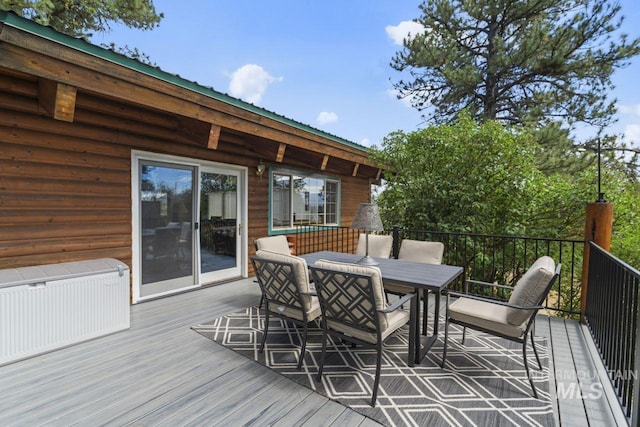 deck with radiator heating unit and outdoor dining space