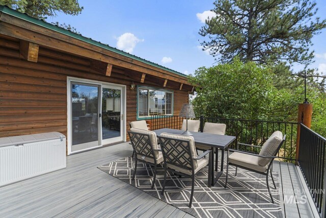 739 S Main St, Cascade, ID 83611 - deck with radiator heating unit and outdoor dining space