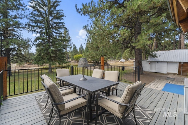 deck with outdoor dining space
