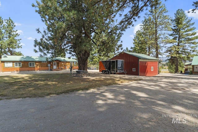 exterior space with an outbuilding and an outdoor structure