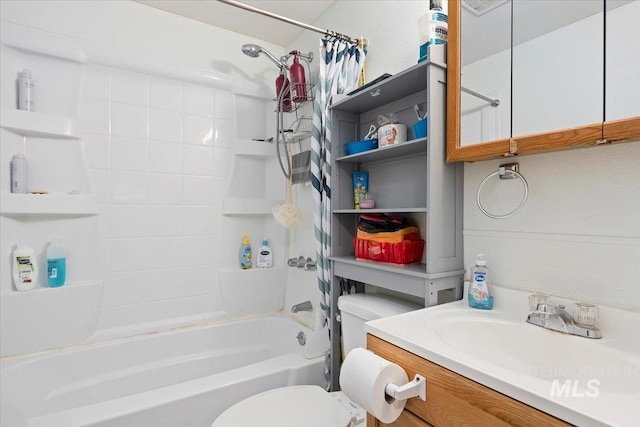 bathroom featuring shower / bath combination with curtain, toilet, and vanity