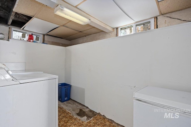 laundry room with washer and dryer and laundry area