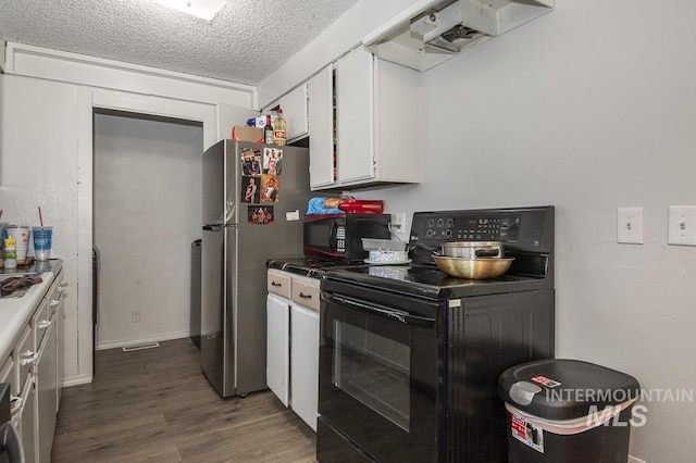 kitchen with black appliances, exhaust hood, a textured ceiling, white cabinetry, and dark hardwood / wood-style flooring