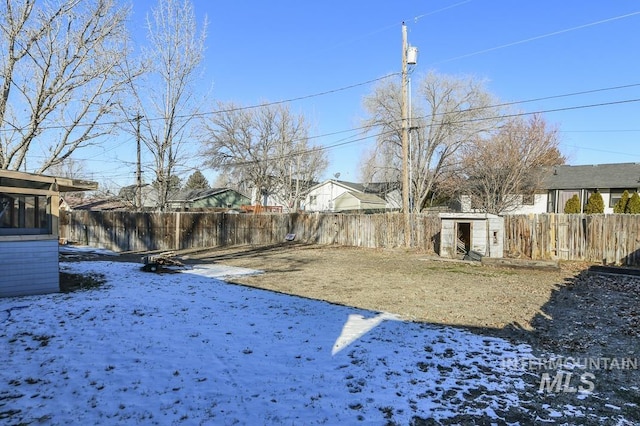 view of yard layered in snow