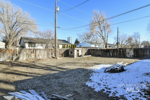 view of yard layered in snow