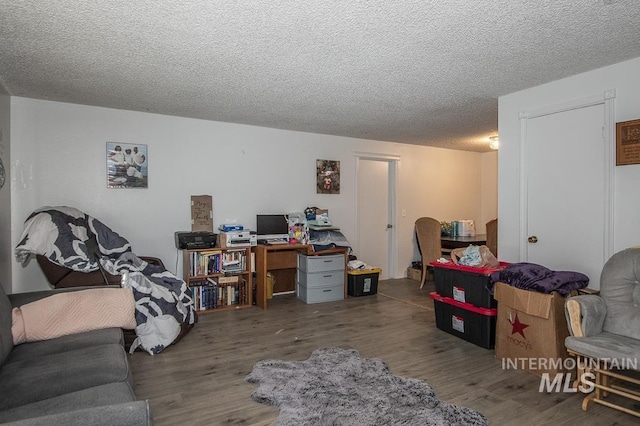 office space featuring hardwood / wood-style floors and a textured ceiling