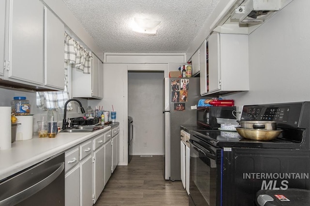 kitchen featuring a textured ceiling, white cabinets, black appliances, sink, and dark hardwood / wood-style floors