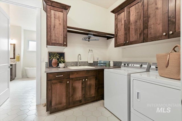 7478 W Palamas, Eagle, ID 83616 - laundry area featuring cabinet space, washing machine and dryer, and light tile patterned floors