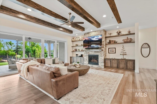 7478 W Palamas, Eagle, ID 83616 - living area featuring beam ceiling, ceiling fan, a stone fireplace, light wood-type flooring, and recessed lighting