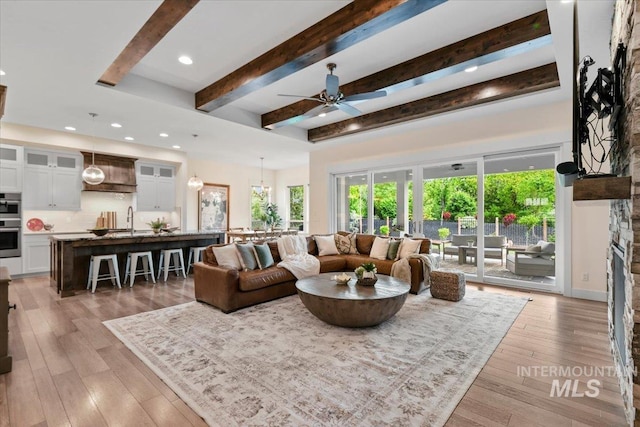 7478 W Palamas, Eagle, ID 83616 - living area featuring beamed ceiling, ceiling fan, healthy amount of natural light, light wood-style flooring, and recessed lighting
