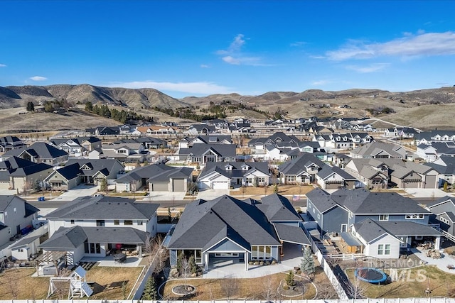 drone / aerial view with a residential view and a mountain view