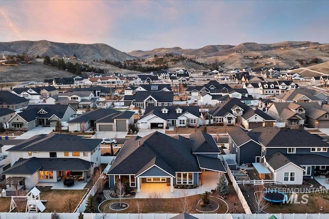 aerial view featuring a mountain view and a residential view